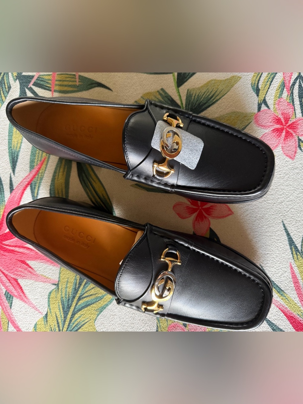 Gucci Black Leather Loafers with Gold/Silver GG logo.